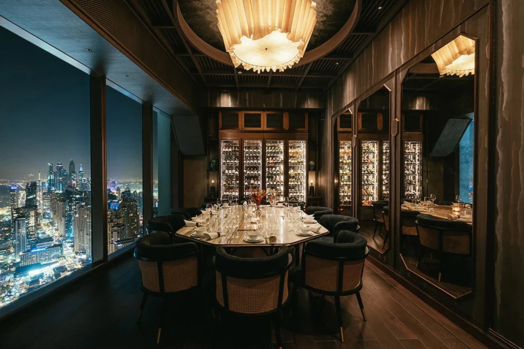 Private dining room with a wine wall and night views over Dubai